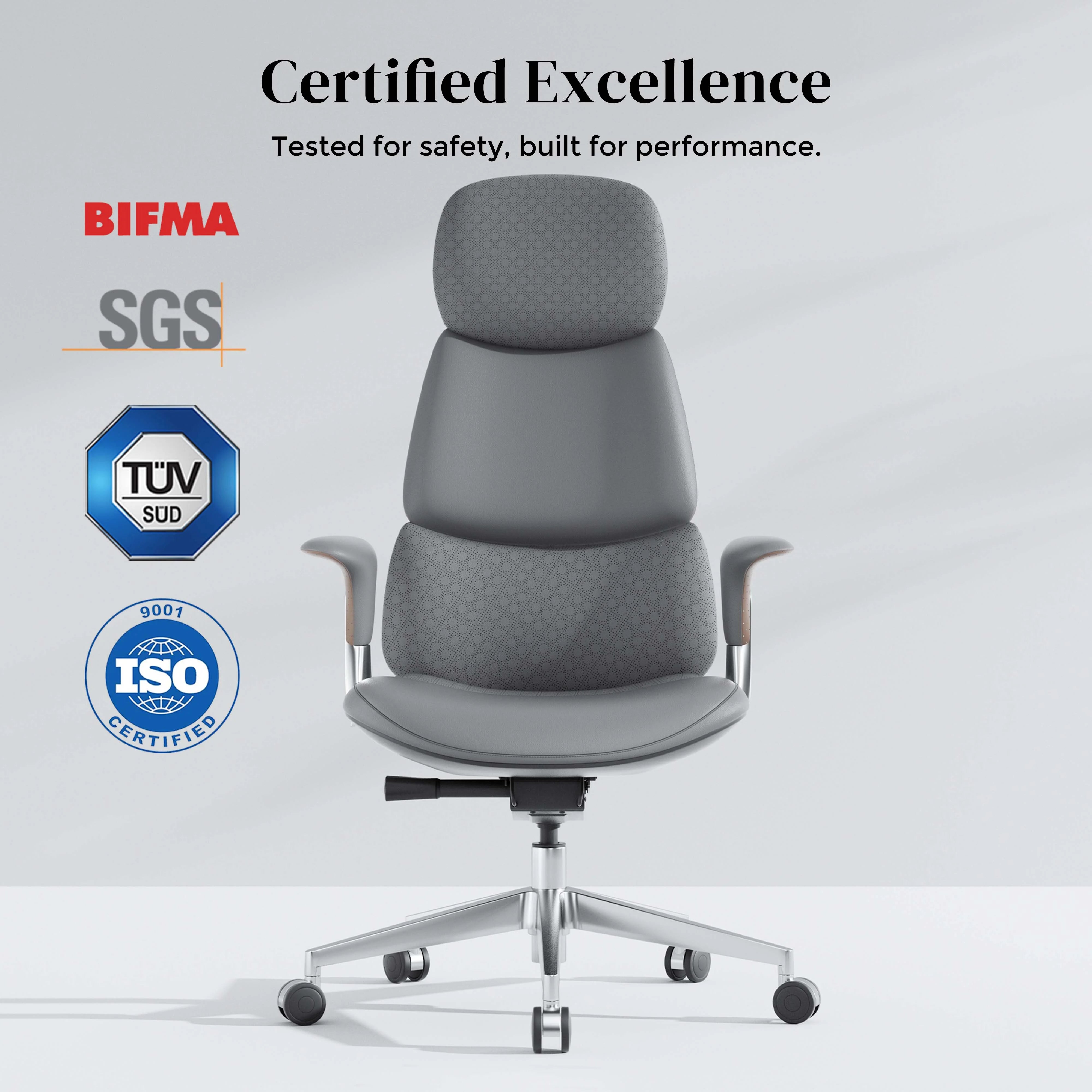 Dark gray upholstered office chair front view with curved backrest and chrome base with casters